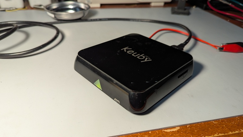 An unopened Keuby Ice box, with a green light showing on the front.